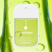 Load image into Gallery viewer, A bottle of Touchland Hand Sanitizer Mist with light green liquid appears amid aloe vera and droplets. The labeled 1 fl oz (30 mL) bottle notes a delicately scented, hydrating formula for your hands.