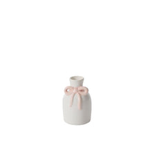Load image into Gallery viewer, The Budvase w/ Bow is a charming ceramic bud vase with a narrow neck and raised pink bow, ideal for spring event decor or as an Easter accent. Shown against a plain white background.