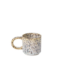 Load image into Gallery viewer, The Starling Mug Collection features a stoneware mug with a wide handle and a brown and cream speckled pattern on white, crafted in an artisanal style and showcased against a plain white backdrop.