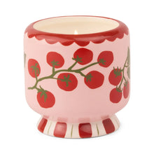 Load image into Gallery viewer, The A Dopo 8oz Ceramic Candle features a pink ceramic holder adorned with red tomatoes, green vines, a red scalloped rim, and a red-and-white striped base, holding a hand-painted candle inspired by Mediterranean fragrance.