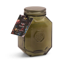 Load image into Gallery viewer, The 8oz Botanica Candle is a green octagonal glass jar with a black lid, decorative Wild Neroli tag, and embossed logo for elegance—a luxurious addition to the Botanica Collection.
