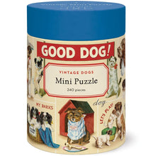 Load image into Gallery viewer, The Vintage 240 Piece Puzzle comes in a cylindrical box with a blue lid, featuring playful dog illustrations and fun sayings—perfect for puzzle lovers or as a charming gift.