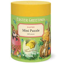 Load image into Gallery viewer, The Vintage 240 Piece Puzzle comes in a cylindrical container with “Easter Greetings” and “Mini Puzzle,” decorated with vintage rabbits, chicks, eggs, flowers, and spring scenes on green with a yellow lid—a delightful gift.