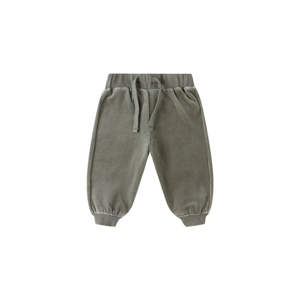 The Velour Relaxed Sweatpant (2 styles) for toddlers in olive green is made from organic cotton, with an elastic waistband, drawstring, and elastic ankle cuffs, shown on a white background.