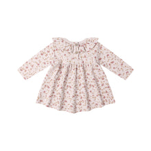 Load image into Gallery viewer, The Ruffle Collar Jersey Dress is a long-sleeved organic cotton baby dress with pink and brown floral garden print on white, featuring a ruffled collar, front buttons, and gathered waist for cute style and comfort.