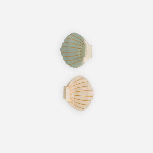 The Shell Clip Set - Seafoam/Natural features two scallop shell-shaped wall hooks—one seafoam green, one cream with gold lines—perfect for adding a coastal summer touch to your space. Displayed on a plain white background.