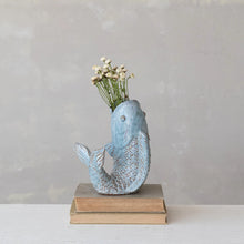 Load image into Gallery viewer, A small blue Fish-Shaped Vase with white flowers, set on two stacked vintage books against a neutral background, brings a touch of coastal home decor.