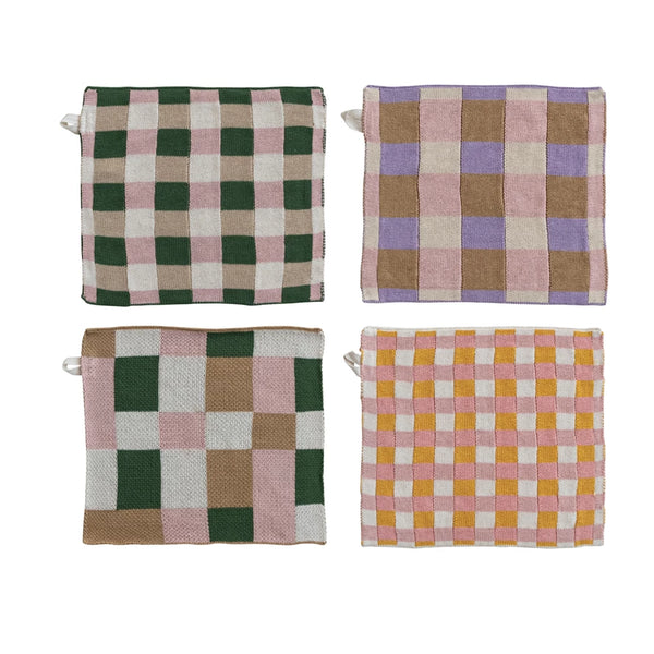 The Dish Cloth w/ 4 Checked & Plaid Styles features four cotton knit pot holders in assorted checked and plaid patterns, each with a hanging loop, arranged in a 2x2 grid on a white background.