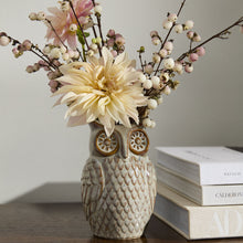 Load image into Gallery viewer, The Great Horned Owl Vase, featuring a grey reactive glaze, displays cream dahlias with white and pink berry sprigs on a wood surface next to stacked books.