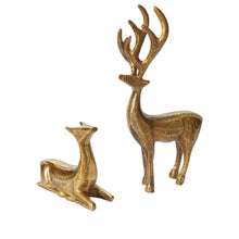 Load image into Gallery viewer, The Golden Prancer Reindeer Figurine set includes one sitting and one standing gold-colored reindeer with large antlers and a textured finish, adding an elegant touch to your holiday decor.