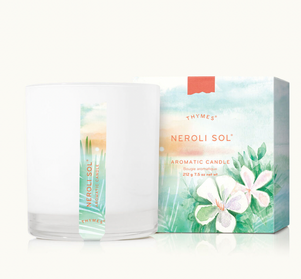 The Thymes Aromatic 8 oz Candle by Lit Decor and Gift, in a white glass jar with a vertical label, offers a clean burn and elegant neroli scent. It comes in a decorative box adorned with watercolor flowers and greenery—perfect for any home.